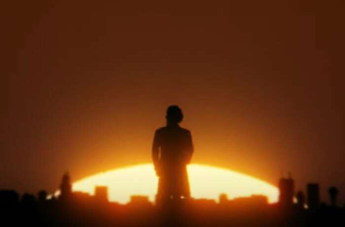 Mann Rücken zur Kamera Sonnenuntergang Skyline