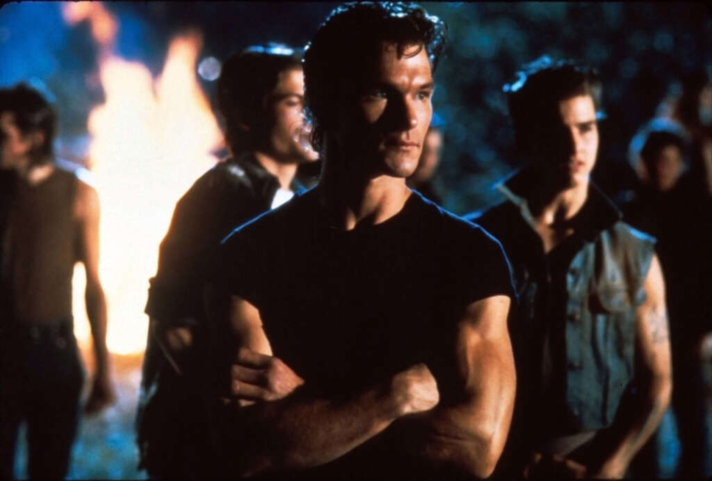 Patrick Swayze gekreuzte Arme Lagerfeuer