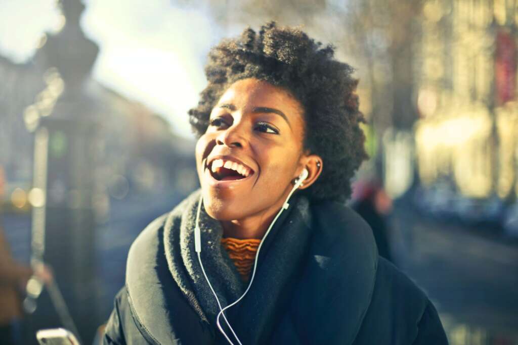 A young women listening to good music with headphones.
