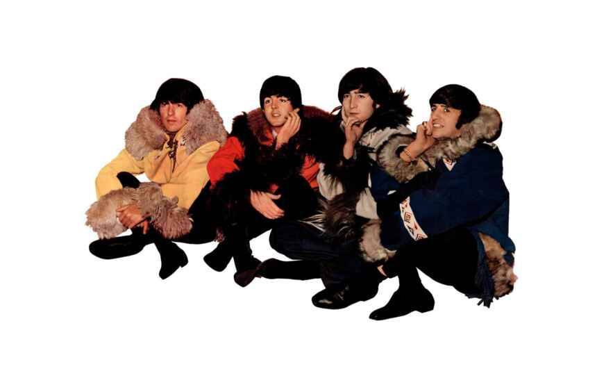 Die Beatles sitzen auf dem Boden