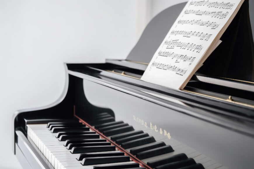 elegant-grand-piano-with-sheet-music-isolated-white-background-close-up-ai-generative