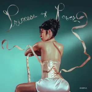 Albumcover von PRINCESS OF POWER: Marina sitzt in einem rückenfreien Glitzeroutfit von der Kamera weggedreht